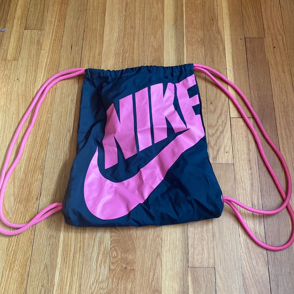 Nike black and pink sling backpack